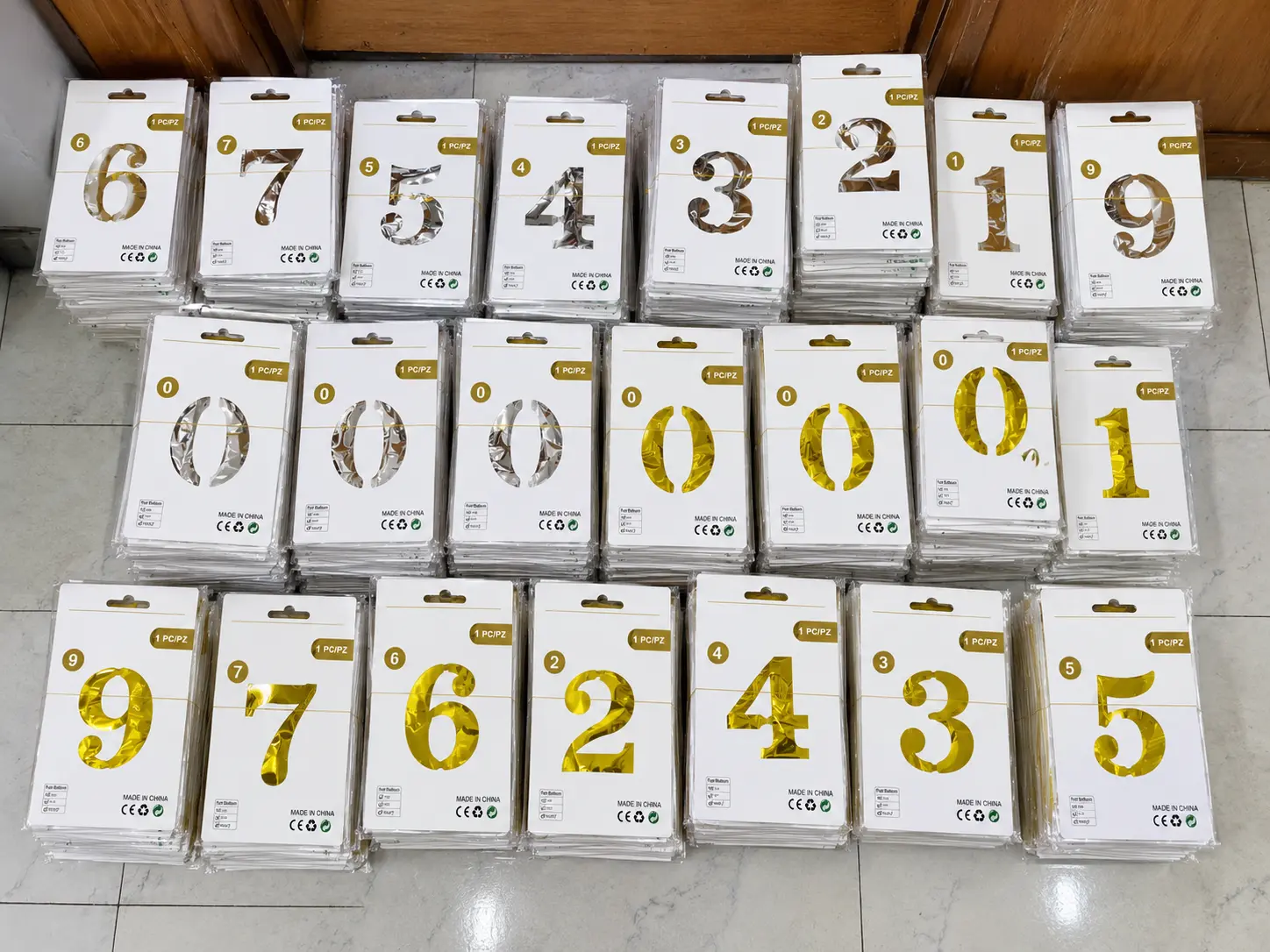 Borun Balloon Factory number foil balloons sorted into individual retail packs by number and metallic color